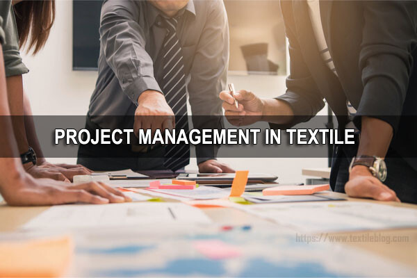 Group of professionals around a table planning a textile project, with documents and sticky notes; banner reads 'PROJECT MANAGEMENT IN TEXTILE'